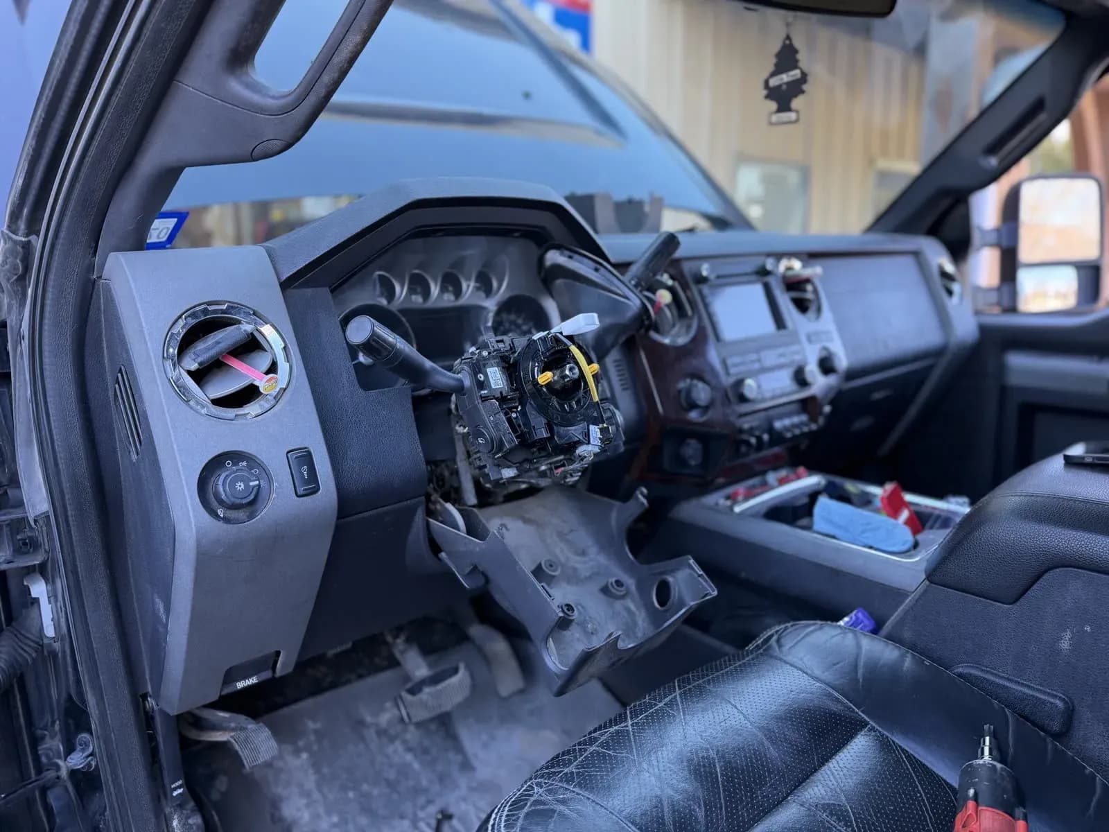 Truck dashboard disassembled for electrical diagnosis and repair