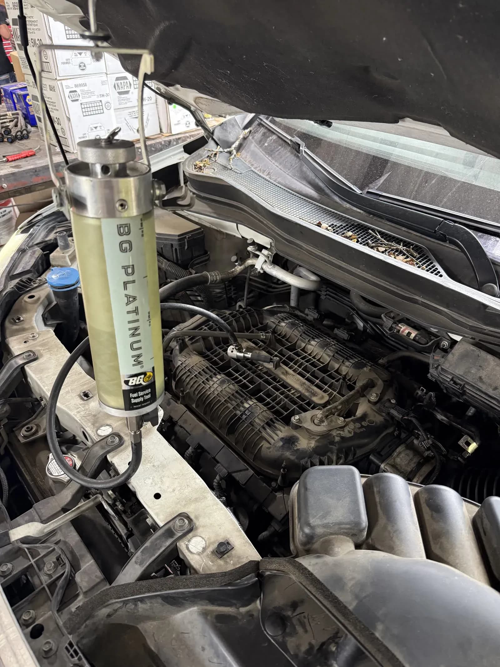 BG Platinum fuel system service being performed in an engine bay