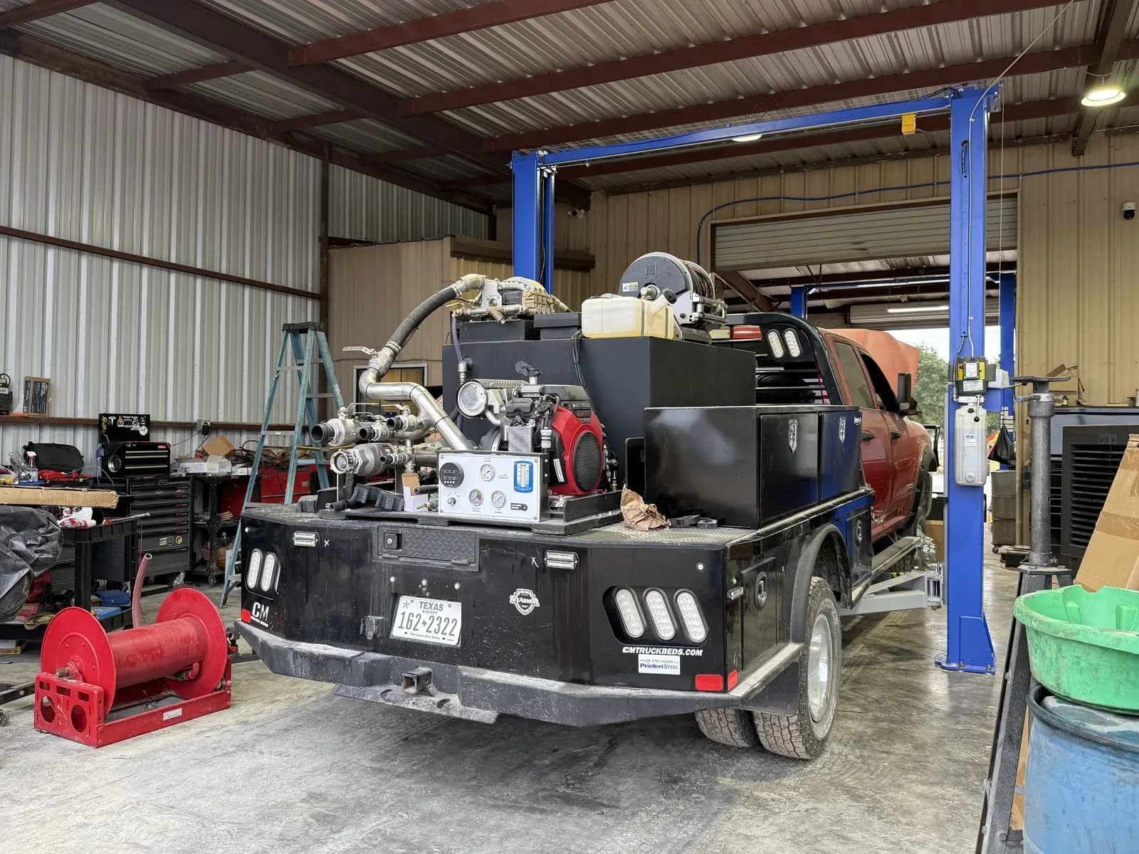 Flatbed work truck with welder rig in the Quality Mechanics shop