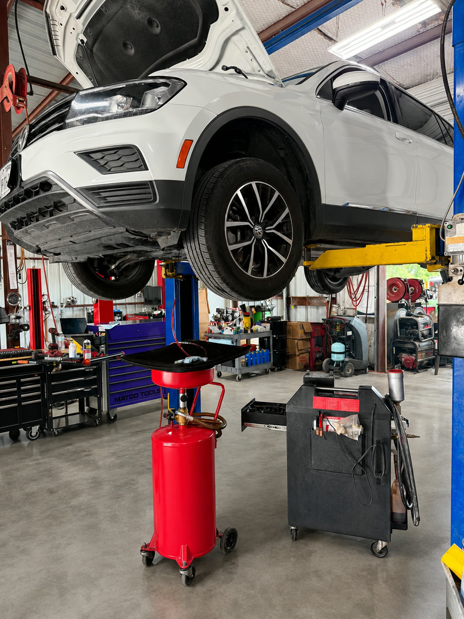 BG BFX transmission fluid exchange machine connected to a vehicle at Quality Mechanics in Waco