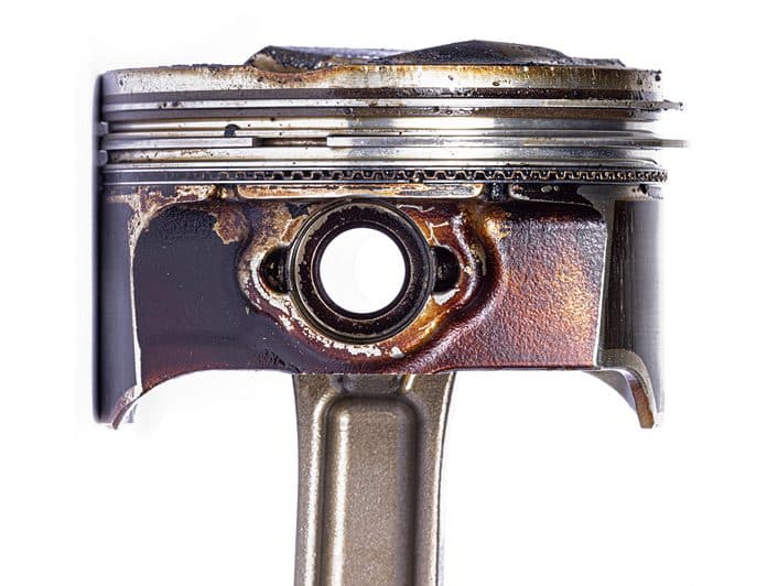 Engine piston deposit comparison — after
