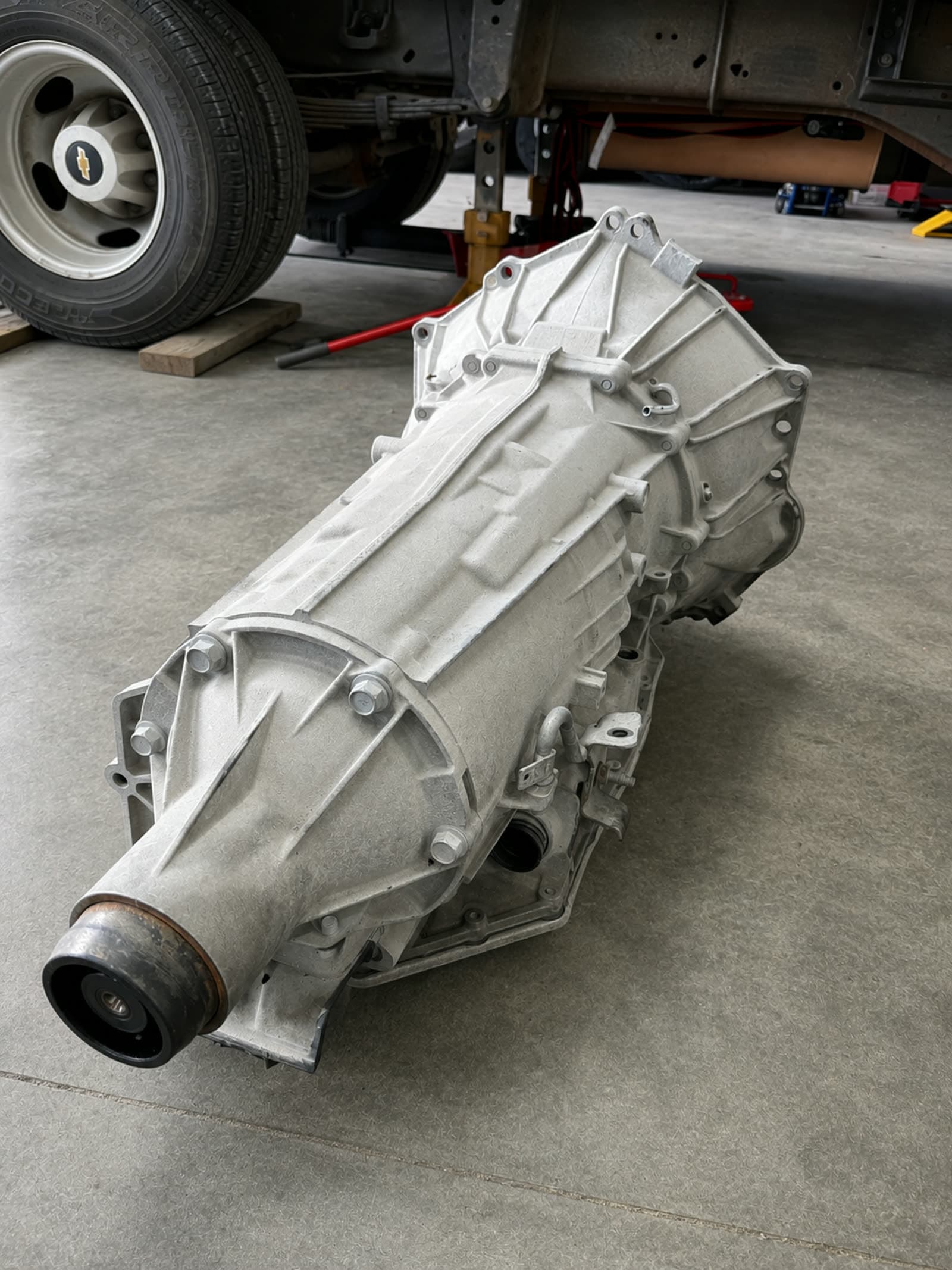 Replacement automatic transmission assembly on the shop floor at Quality Mechanics before installation